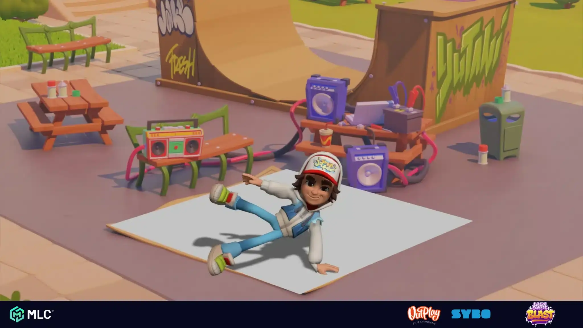 Boy performing breakdance on skateboard in skate park surrounded by graffiti and benches at daytime.