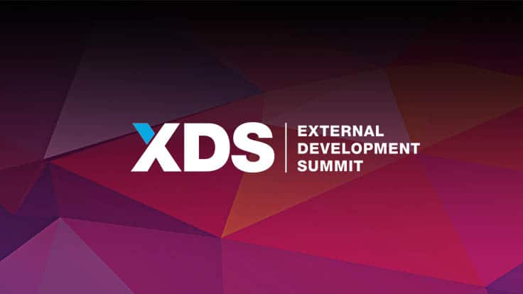 XDS External Development Summit logo on a colourful geometric background, promotional graphic for game industry event.