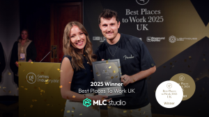 Winner receiving award at the 2025 UK Best Places to Work event with confetti falling. 